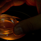 An embryologist adjusting a microplate containing embryos.